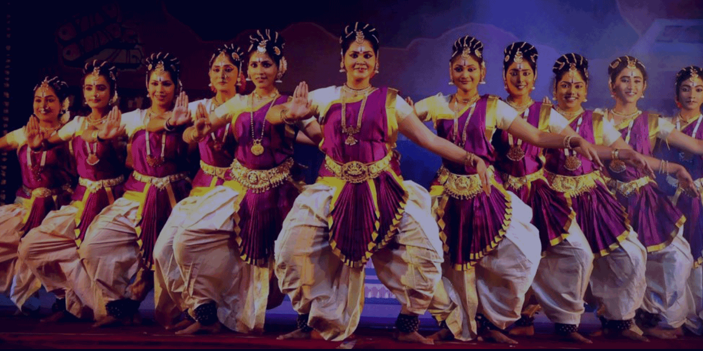 Classical dancers performing together on stage